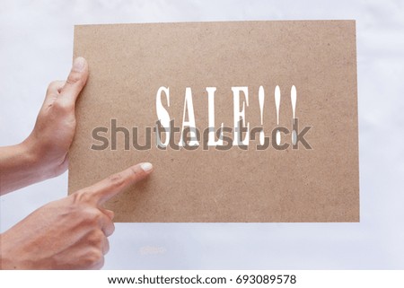 SALE Text On Wooden Board Over White Background