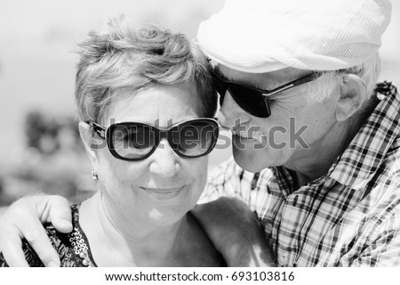 Outdoor portrait of two 70 years old senior people