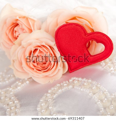 red valentine heart with flowers on white silk with beads