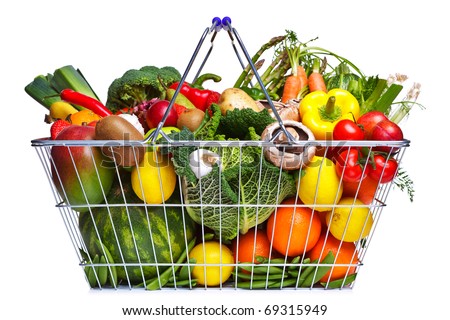 Photo of a wire shopping basket full of fresh fruit and vegetables, isolated on a white background. Royalty-Free Stock Photo #69315949