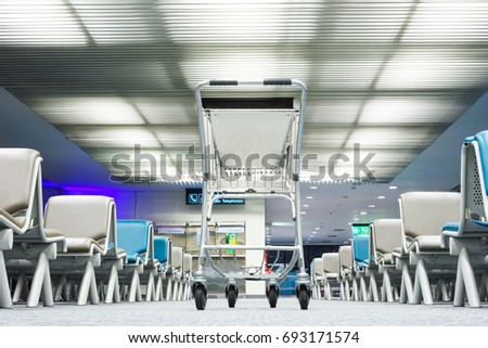 A cart in airport terminal at night