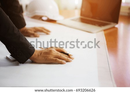 Man engineer with plan paper on desk / copy space