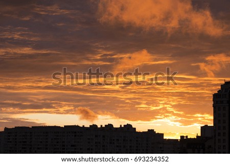 Evening sky over the city / red clouds