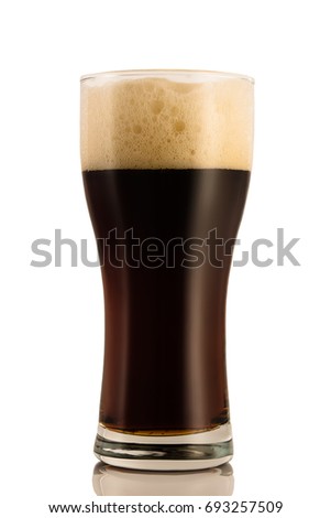 Dark beer in a glass, isolated on a white background.