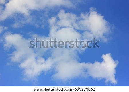 White clouds in the blue sky.