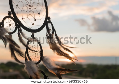 Dream Catcher on the sunset background Royalty-Free Stock Photo #693330766
