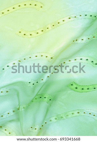 Silk fabric texture, background. green and yellow color
