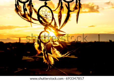 Dream Catcher on the sunset background Royalty-Free Stock Photo #693347857