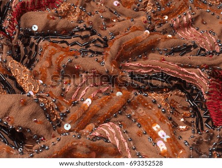 Fabric brown encrusted beads, sequins, beads. Photography Studio
