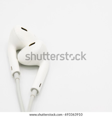 Close up of White Earphones on white background. Copy space. Music is my life concept