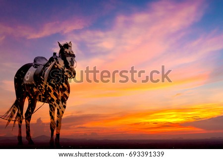 Double exposure of a horse and trees on sky sunset 