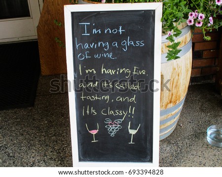 funny sign outside of a wine tasting vinyard 