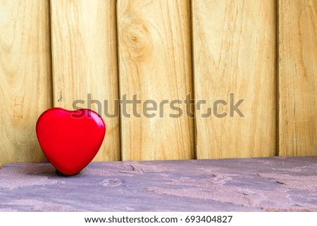 box heart shape on a wood background. Using wallpaper or background. For package or product and  note copy space.
