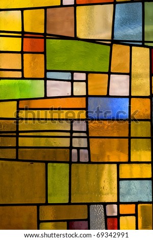 Multicolored stained glass church window, portrait orientation