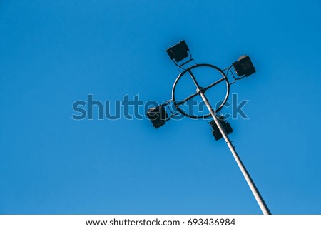 lamp pole spotlight blue sky electricity