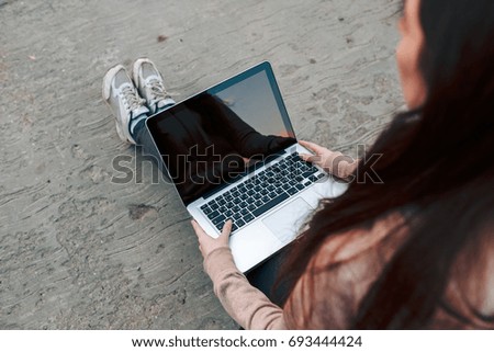 Beautiful Young Girl Working on Laptop Outside Her Office, Freelance Concept.