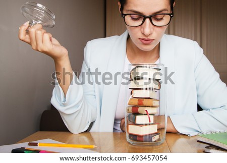 Girl student with books.  Royalty-Free Stock Photo #693457054