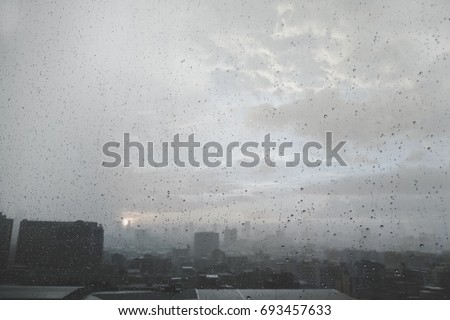 City views of rain or water drops on a window glass