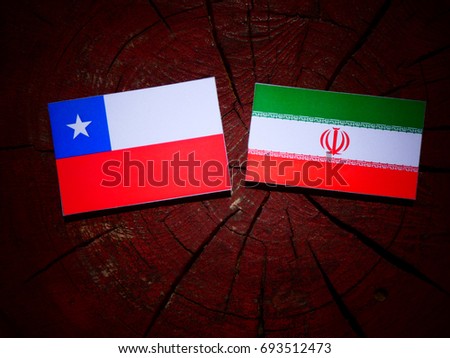 Chilean flag with Iranian flag on a tree stump isolated