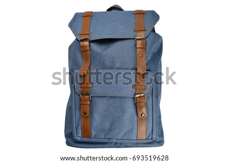 Canvas Backpack accessories isolated hipster background white. Blue with brown bag. Hand made backpack for travelers. Royalty-Free Stock Photo #693519628
