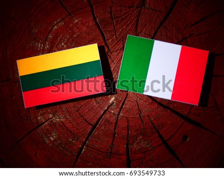Lithuanian flag with Italian flag on a tree stump isolated
