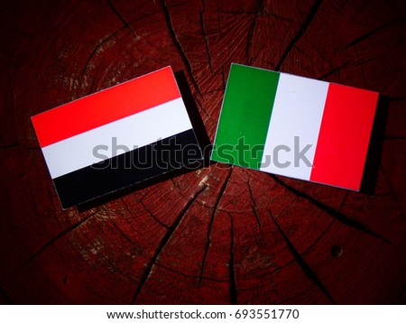 Yemeni flag with Italian flag on a tree stump isolated