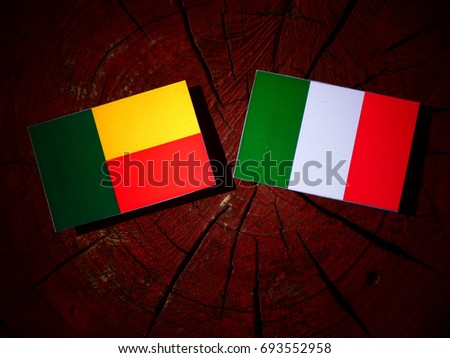 Benin flag with Italian flag on a tree stump isolated