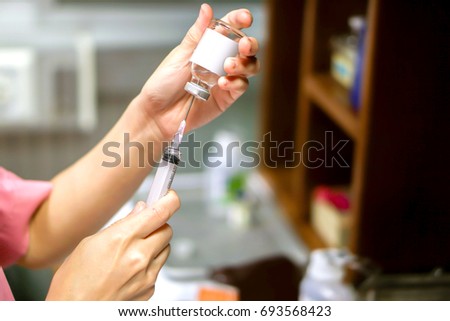 A picture of nurse hands in preparation an injection vaccine for the patient.