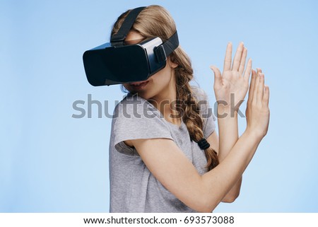 Woman playing games 3d on a blue background                               