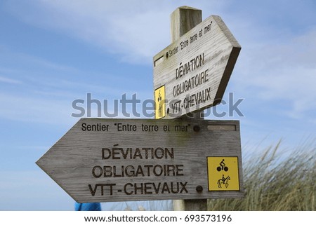 Direction sign on the seashore