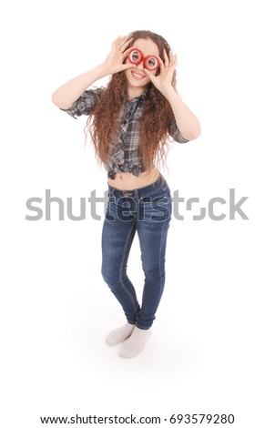 Portrait of a funny young girl looking at camera through insulating tape isolated on a white background