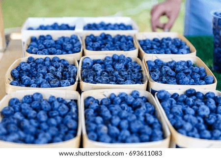 Delicious ripe blueberries lie in baskets