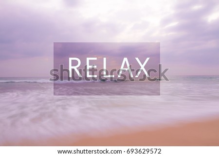 Beautiful background with blur seaside in pink colors and relax word. Yoga, relaxation, meditation , calmness concept