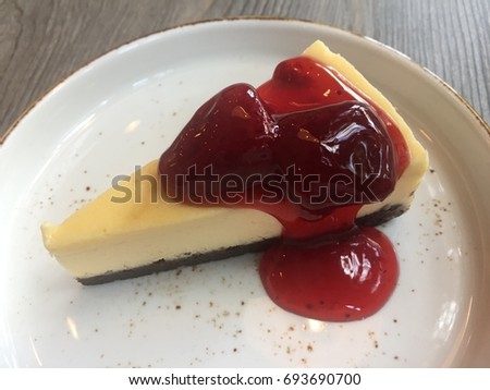 amazing delicious homemade chocolate cheesecake topped with strawberry sauce picture