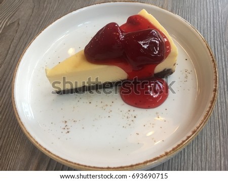 amazing delicious homemade chocolate cheesecake topped with strawberry sauce picture