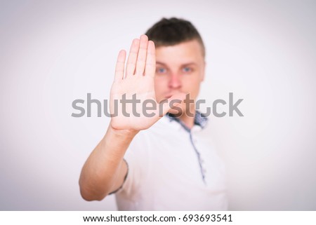 The man shows the stop gesture