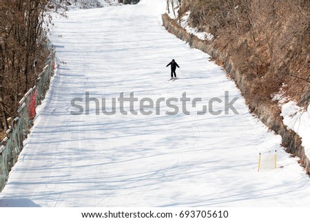 One Person Skiing Downhills on Snowy Slope in South Korea Ski Resort.
