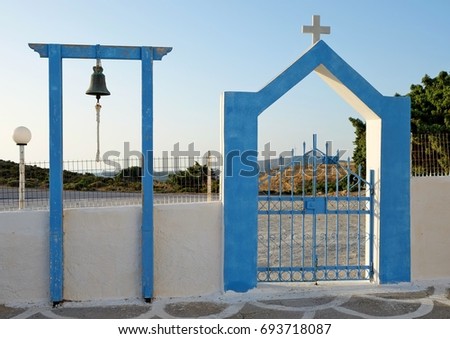 Entrance with bell to the old Greek church. Kos island, Greece. 
