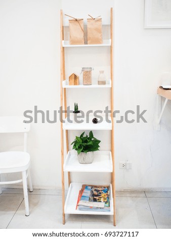 wood rack style in the kitchen and white wall.