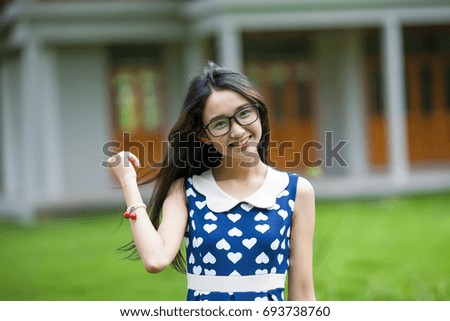 Beautiful lady wearing glasses, smiling 