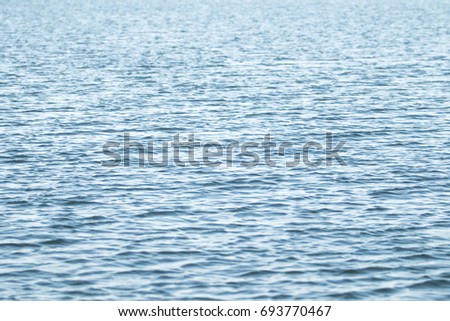 Stormy current on water background