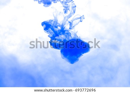 Blue ink in water background