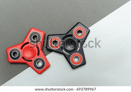 Two spinners on a gray background.