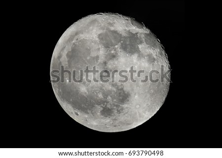 Full moon half moon hole on sky black background at night 
