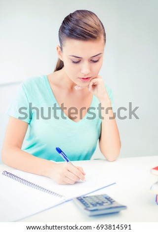 picture of student girl with notebook and calculator