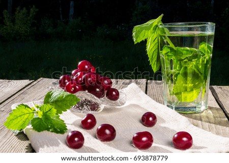 Mint tea with cherry berries. Copy space.