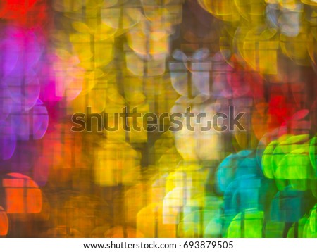 Beautiful background with different colored gift, abstract background, gift shapes on black background, blurry
