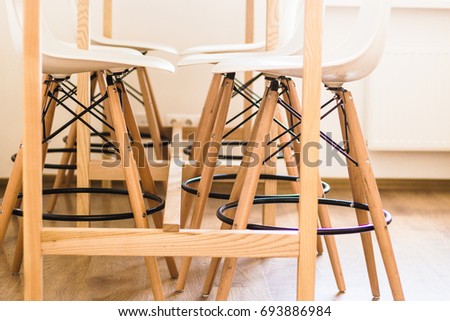 Office interior. Wooden office furniture - chairs and table closeup