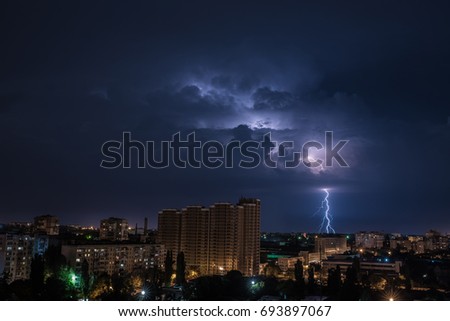 Photo of beautiful powerful lightning over big city. The photo was taken with a long exposure.