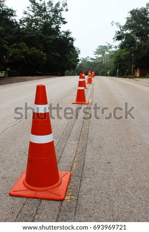 Line of traffic cone on road